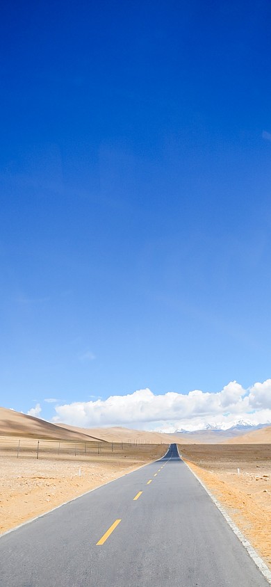 西藏公路荒漠蓝天手机壁纸