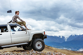 4 x 4 off-road car concept with mountains and rivers with men