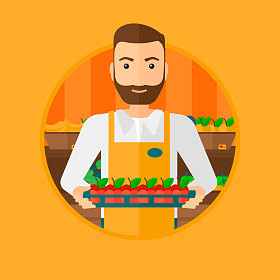 超市工作人员与装满苹果的箱子