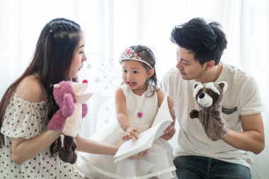 The concept of family, child and family - smiling parents and little girls