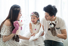 The concept of family, child and family - smiling parents and little girls