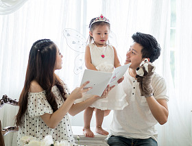 The concept of family, child and family - smiling parents and little girls