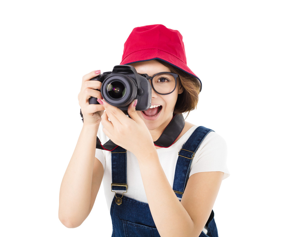 幸福的年轻女人拍照相机 幸福的年轻女人拍照相机