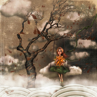 一個(gè)女孩坐在一棵樹上的秋千上