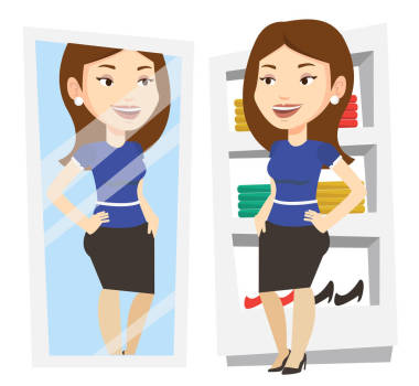 試衣服在更衣室里的女人.圖片