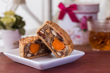 Moon cakes and tea - Traditional Chinese moon cakes on a whiteboard