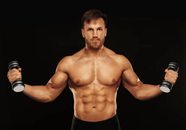 哑铃运动的年轻人照片