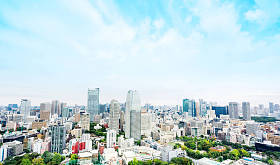 Concept of business and Culture -- modern city skyline panoramic aerial view from Tokyo Tower below the dramatic blue morning cloudy sky in Tokyo, Japan