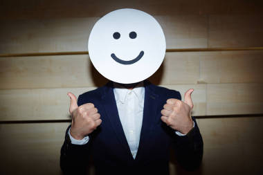 商人在臉上微笑面具圖片