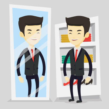 試衣服在更衣室里的男人