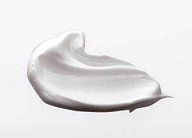 涂奶油白色背景上分离。乳霜质地