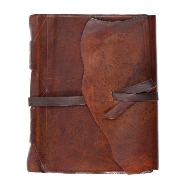 在白色背景上的皮革的日記書照片