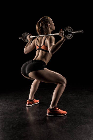 女運(yùn)動(dòng)員與杠鈴訓(xùn)練 照片
