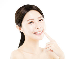 特写快乐年轻女人美丽的脸 照片