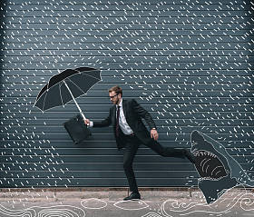 运行着雨伞的商人图片
