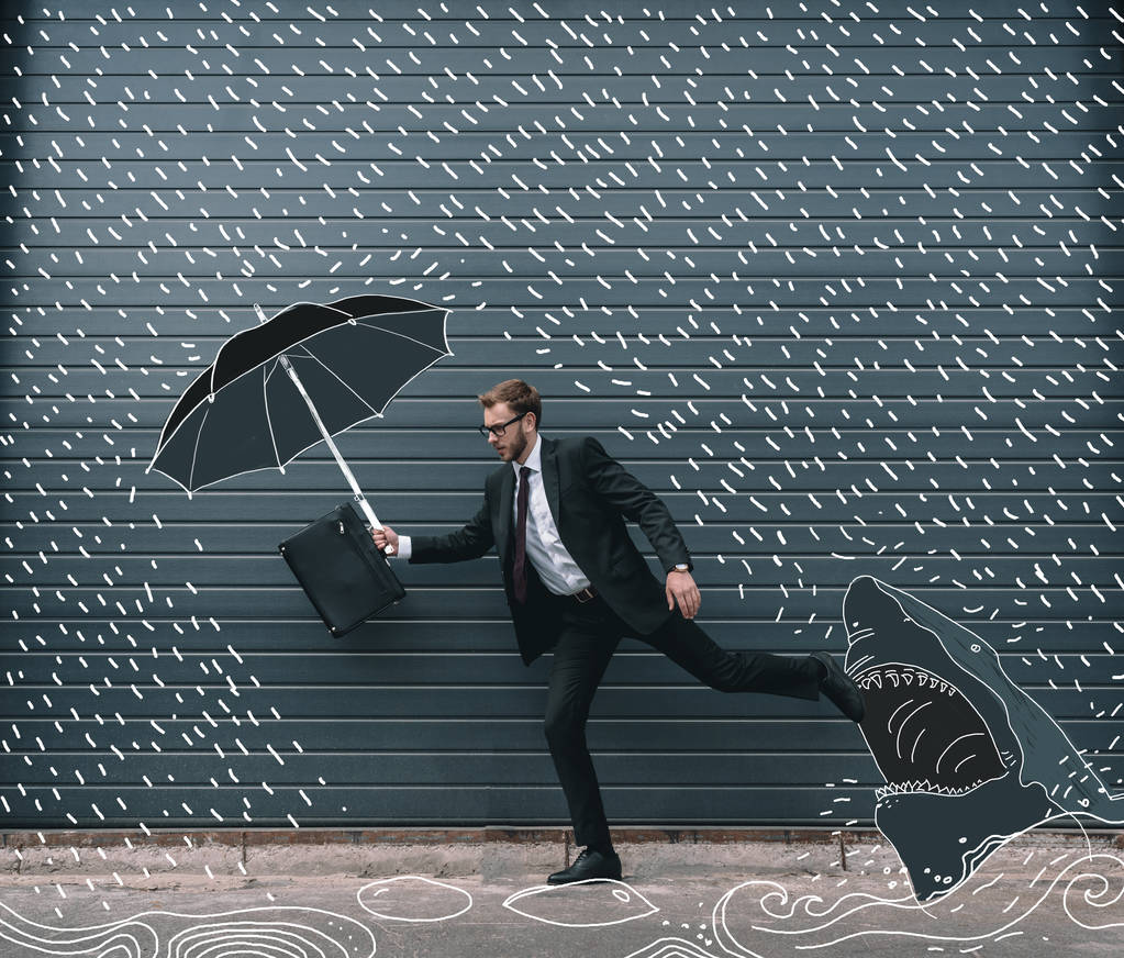 运行着雨伞的商人图片