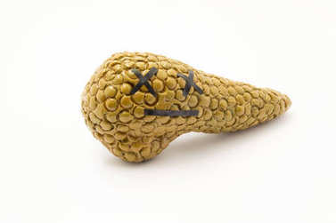 Concept photos of death as a function of organ, fatal disease, or pancreatic failure. Pancreatic anatomy with an emotional dead smile symbolizing failure, severe disease -- cancer, and pancreonecrosis