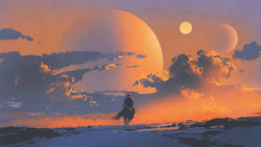 牛仔騎著馬反對(duì)的夕陽(yáng)的天空