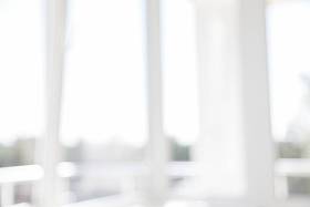 模糊办公室背景建筑外部视图到大堂玻璃窗口