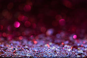 圣诞背景粉红色和银色闪亮的五彩纸屑明星