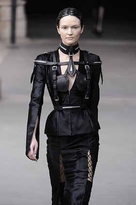 Paris, France - March 08: Models walk to the runway as Alexander McQueen prepares to wear the Winter 2011 Fall 2012 show during Paris Fashion Week on a special plane at La Franc on March 8, 2011 in Paris