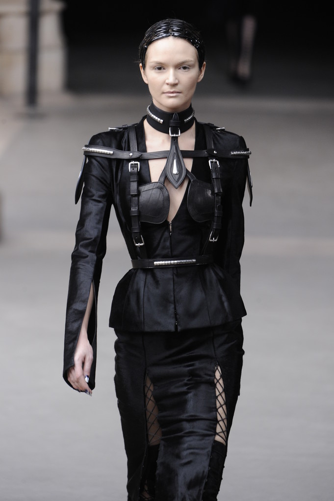 Paris, France - March 08: Models walk to the runway as Alexander McQueen prepares to wear the Winter 2011 Fall 2012 show during Paris Fashion Week on a special plane at La Franc on March 8, 2011 in Paris Paris, France - March 08: Models walk to the runway as Alexander McQueen prepares to wear the Winter 2011 Fall 2012 show during Paris Fashion Week on a special plane at La Franc on March 8, 2011 in Paris