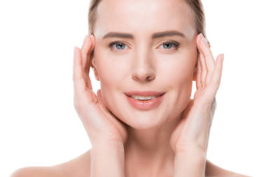 女性与新鲜干净的皮肤触摸自己的脸上孤立的白色