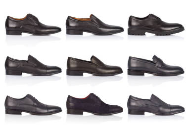 男性鞋收集在白色的背景, 在光澤的表面上的陰影。前視圖。9件