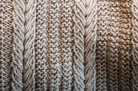 针织质地。用羊毛制成的花纹织物。背景, 复制空间