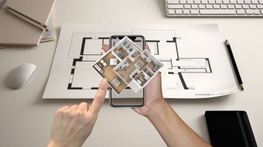 增强的现实概念。手持智能手机与 Ar 应用用于模拟3d 弹出式交互式住宅地图的生活