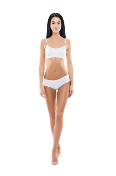 適合和運(yùn)動(dòng)的女孩內(nèi)衣。美麗和健康的女人擺在白色的背景。運(yùn)動(dòng), 健身, 飲食, 減肥和醫(yī)療保健理念