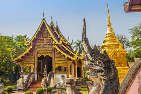 Lana-style Buddhist church in Reclining Buddha Temple (Lion Buddha Temple) with blue sky background. Pula Singh Temple is an important Buddhist monastery and temple on the western side of Chiang Mai, Thailand