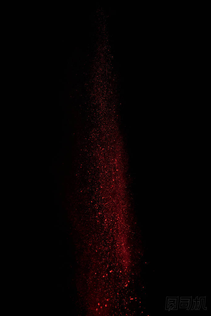  紅色粉末在空氣中, 落在黑色背景