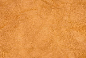 棕色或橙色纹理皮革背景。抽象皮革纹理. 