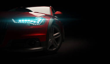 黑色背景上的時尚汽車, 開著 led 燈。未來派現(xiàn)代車輛頭部在黑暗中發(fā)光。3d 渲染