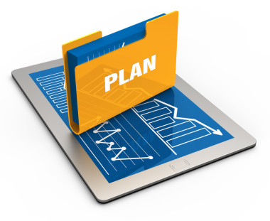 平板電腦屏幕與黃色文件夾圖片