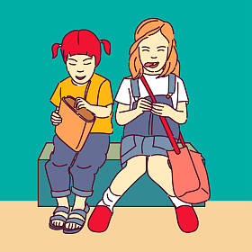 两个女学生坐在绿色背景
