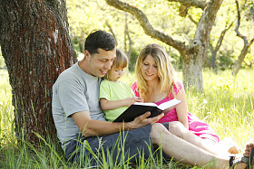Young families reading the Bible