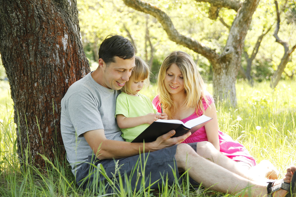 Young families reading the Bible Young families reading the Bible