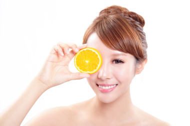 美麗的女人臉多汁橙圖片
