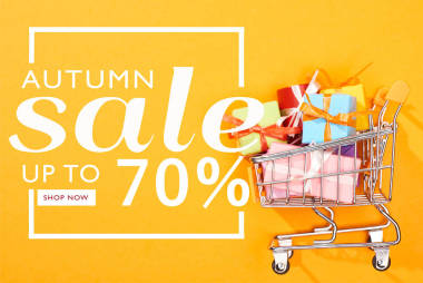 購物車的頂部視圖與明亮的橙色背景，秋季銷售，高達(dá)70%的插圖