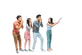 震惊的朋友们指着白色上孤立的东西 