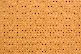 黄色穿孔人造皮革背景纹理