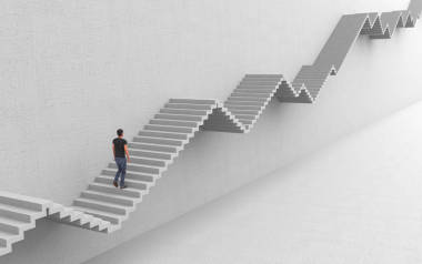 An ambitious man is walking up the stairs to his purpose rising up and down. Hard way to success on a career ladder. Con