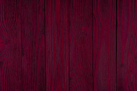 红木质地。背景旧红色面板. 