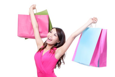 快樂購物的年輕女人圖片