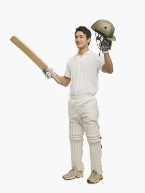 慶祝他的成功的板球擊球手圖片