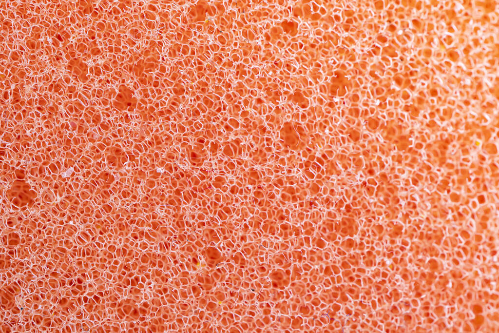 橙色海绵细密质感，海绵质感背景。Closeup, macro