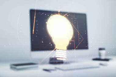 創(chuàng)意燈泡演示現(xiàn)代計算機(jī)背景,未來的技術(shù)概念.多重接觸