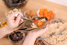Zongzi, an ingredient for Chinese dumplings, is placed on a table at home during the Dragon Boat Festival celebration